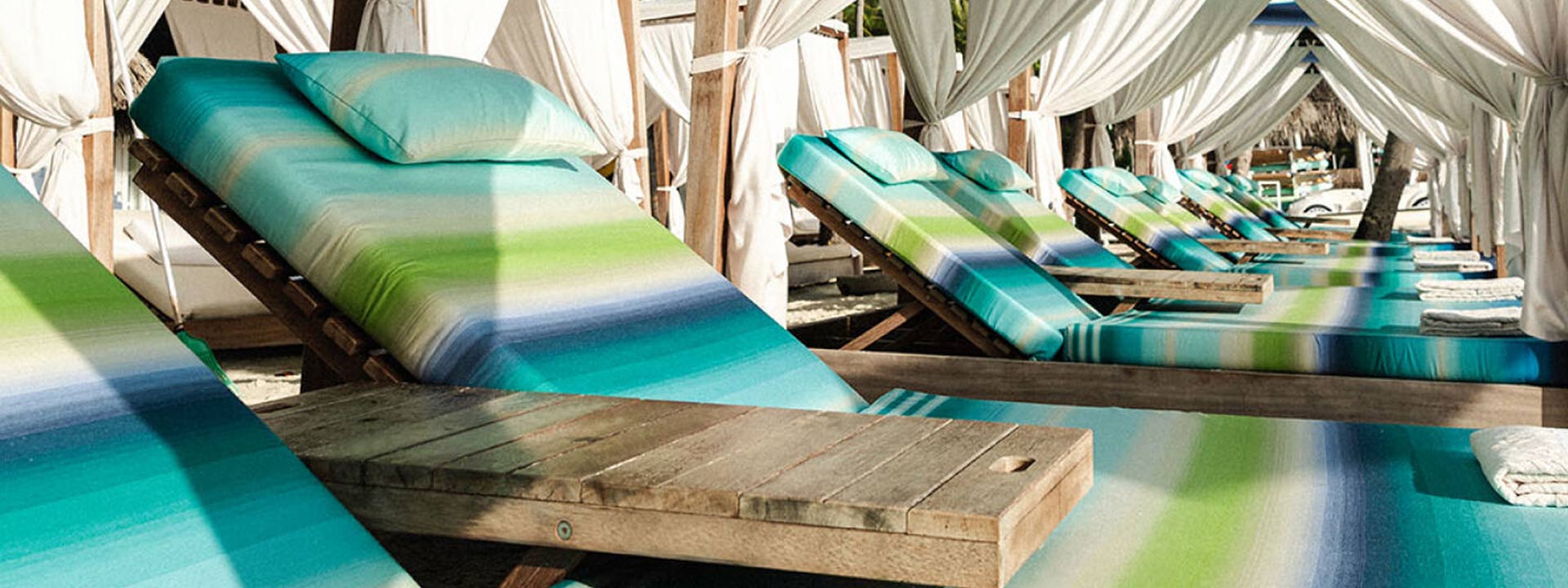 Different chairs covered in multicolor Missoni sheets